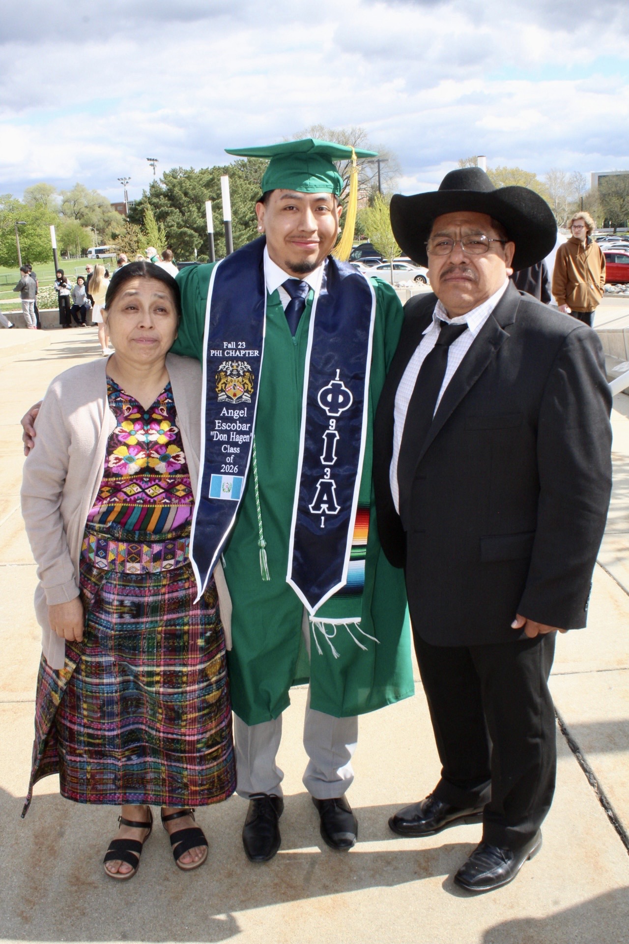 First-generation graduate standing with family